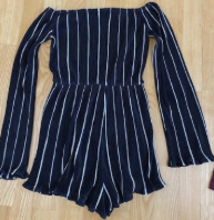 jumpsuit zwart met witte strepen geribbeld met lange mouwen
