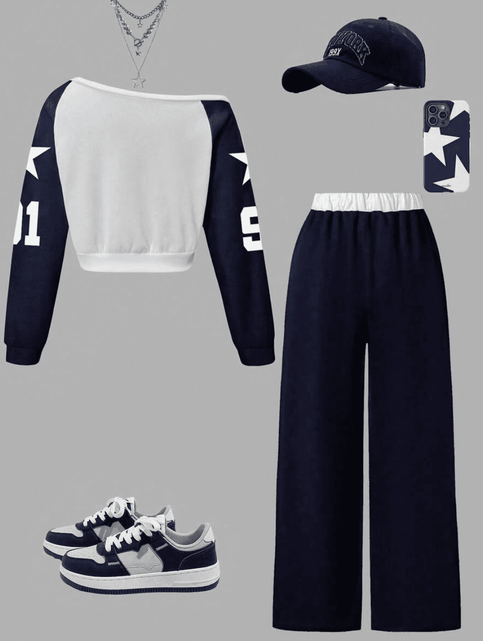 donker blauwe broek, witte trui met blauwe mouwen - Foto 2